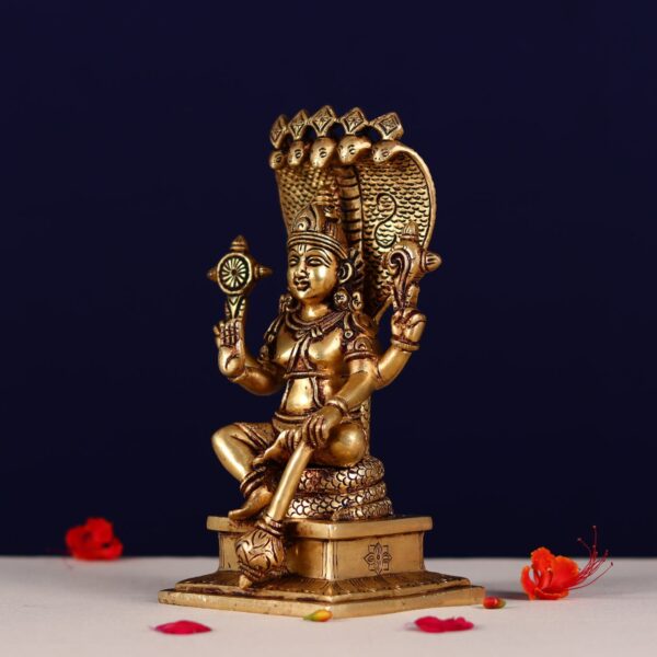 Brass lord narayan statue sitting on shesh nag