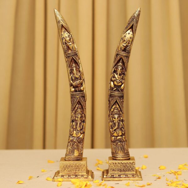 brass elephant tusk with ganesh crafted on it 12 inches