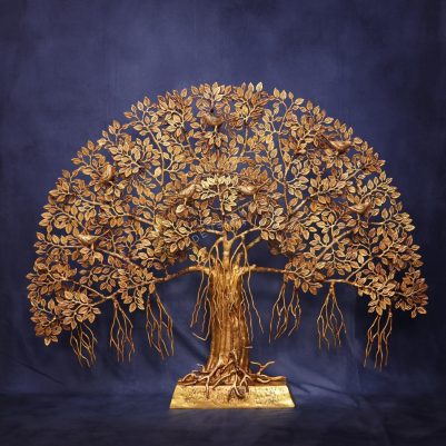 Large brass Tree of Life features intricate leaves and perched birds, elegantly displayed on a sturdy stand.